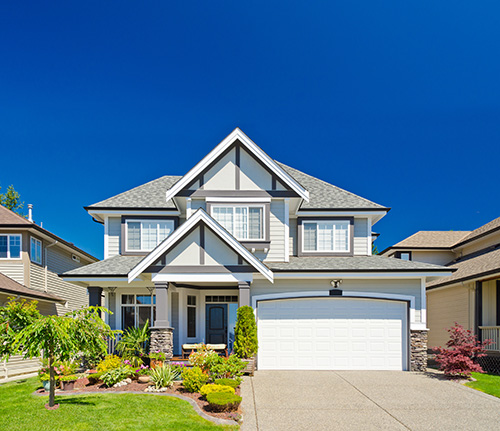 Front view of new home with blue sky.